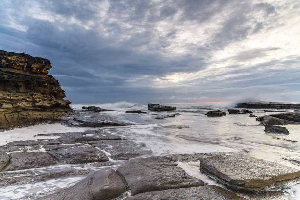istock Sunrise Seascape with Cloud Covered Sky from Rocky Inlet 1213778491