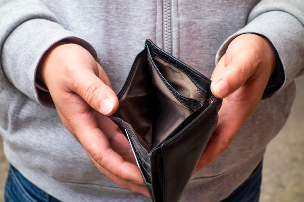 istock The man has an empty wallet in his hand 1213779660