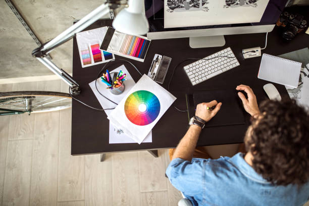 Digital Artist Working At Home Handsome Young Man Working In Comfort of His Home graphic designer stock pictures, royalty-free photos & images