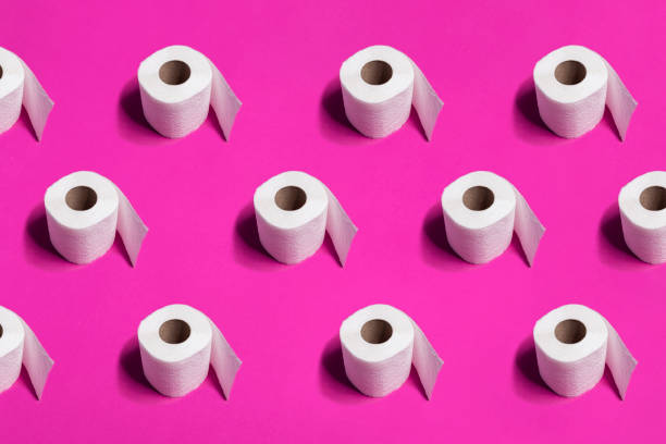 istock White toilet paper rolls on pink background 1213780596