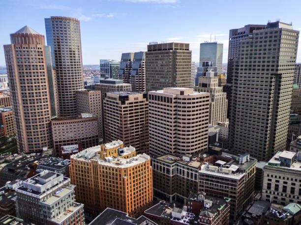 Skyline of Downtown Boston, Massachusetts Aerial View of Downtown Boston (Financial District Skyline) and Boston Waterfront - Boston, Massachusetts, USA boston harbor stock pictures, royalty-free photos & images