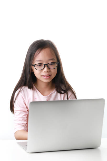 istock Young Asian girl using laptop 1213781596