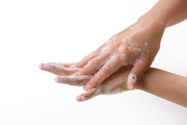 istock Young Adult Washing Hands With Soap 1213781668