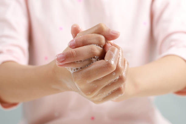 istock Young Adult Washing Hands With Soap 1213781796