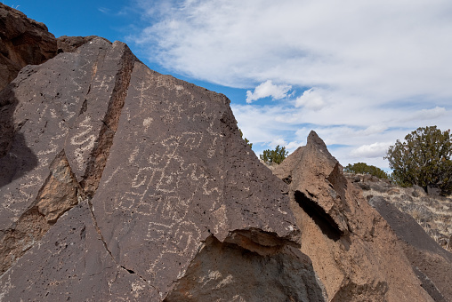 Nearly a thousand years ago natives inhabited the lower elevations around the San Francisco Peaks of Arizona. In an area so dry it would seem impossible to live, they built pueblos, harvested rainwater, grew crops and raised families. Today the remnants of their villages dot the landscape along with their other artifacts. These petroglyphs were found on Magnetic Mesa in Wupatki National Monument near Flagstaff, Arizona, USA.