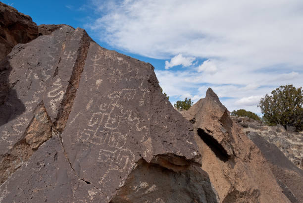 Ancient Petroglyphs Nearly a thousand years ago natives inhabited the lower elevations around the San Francisco Peaks of Arizona. In an area so dry it would seem impossible to live, they built pueblos, harvested rainwater, grew crops and raised families. Today the remnants of their villages dot the landscape along with their other artifacts. These petroglyphs were found on Magnetic Mesa in Wupatki National Monument near Flagstaff, Arizona, USA. jeff goulden southwest usa stock pictures, royalty-free photos & images