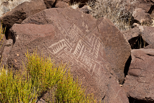 Nearly a thousand years ago natives inhabited the lower elevations around the San Francisco Peaks of Arizona.  In an area so dry it would seem impossible to live, they built pueblos, harvested rainwater, grew crops and raised families.  Today the remnants of their villages dot the landscape along with their other artifacts.  These petroglyphs were found on Magnetic Mesa in Wupatki National Monument near Flagstaff, Arizona, USA.