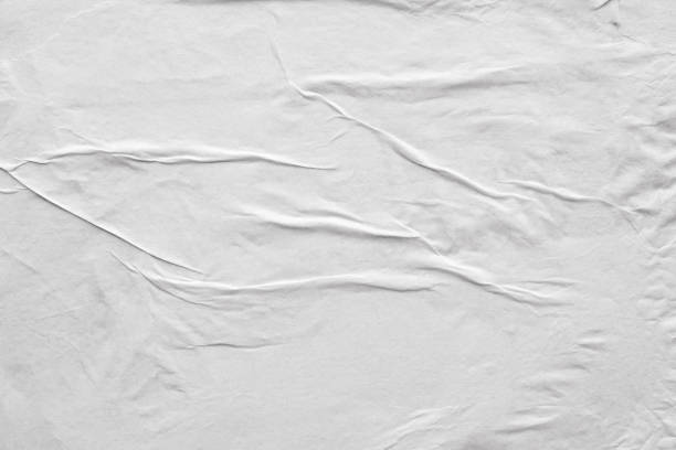 istock Blank white crumpled and creased paper poster texture background 1213783477