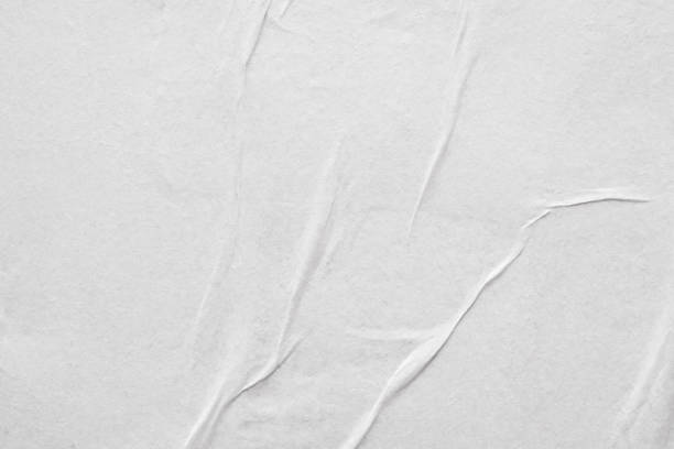 istock Blank white crumpled and creased paper poster texture background 1213783478