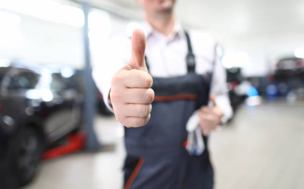 istock Male mechanic fixing damaged auto 1213783634
