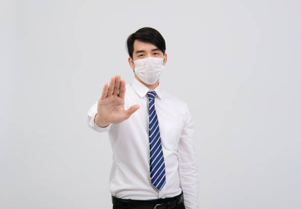 istock businessman man wearing protective mask against cold flu virus bacteria infection pollution 1213783798