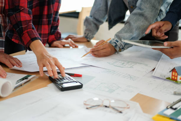 istock architect engineer team working discussing on house blueprint of real estate project in meeting 1213783851