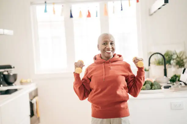 Senior women taking care of herself  she exercise with  dumbbells