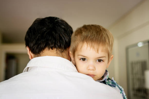 istock Father holding son on his arms 1213785572