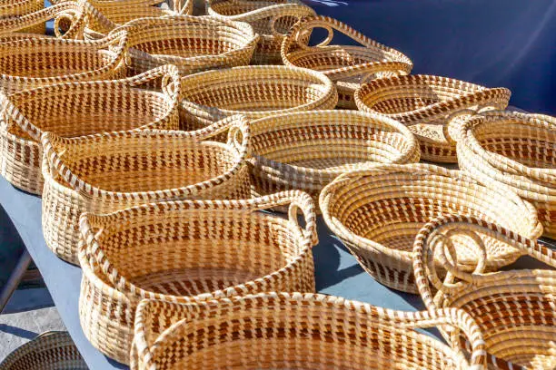 Sweetgrass Baskets,  beautiful handicrafts of African origin, on display at historic Charleston City Market in Charleston, South Carolina.