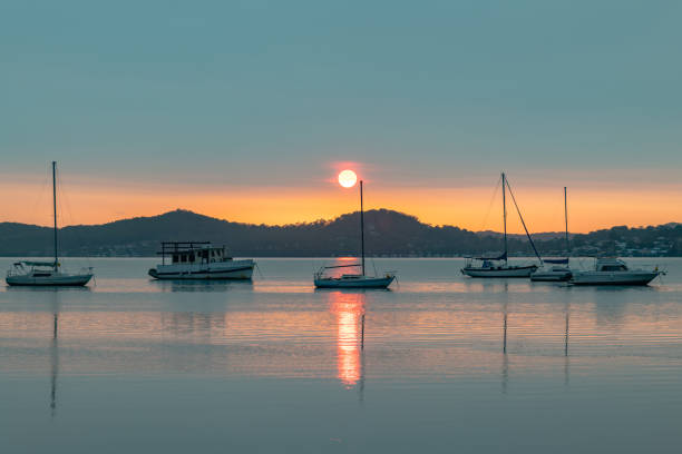 istock A Blanketed Sky, Boats and Reflections on the Bay 1213796543