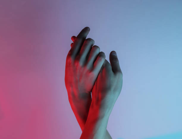 istock Women's hands. Neon blue-red light. Mystical light, Halloween theme. Retro wave 80s 1213801395