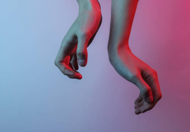 istock Women's hands. Neon blue-red light. Mystical light, Halloween theme. Retro wave 80s 1213801401