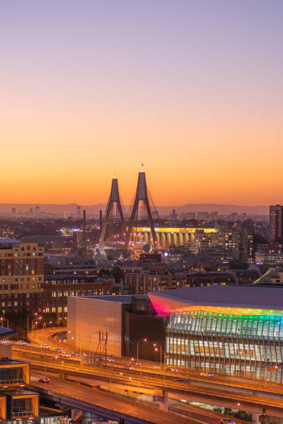 ANZAC bridge in Sydney, during sunset time with buildings in background.  The anzac bridge is an 8-lane cable-stayed bridge spanning Johnstons Bay between Pyrmont and Glebe Island close to the central business district of Sydney,Australia : 20-03-2020 stock photo