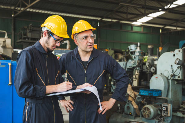 istock Industrial workers are working on projects in large industrial plants with many devices. 1213804493