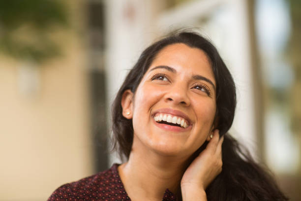 istock Young Hispanic woman smiling. 1213805788