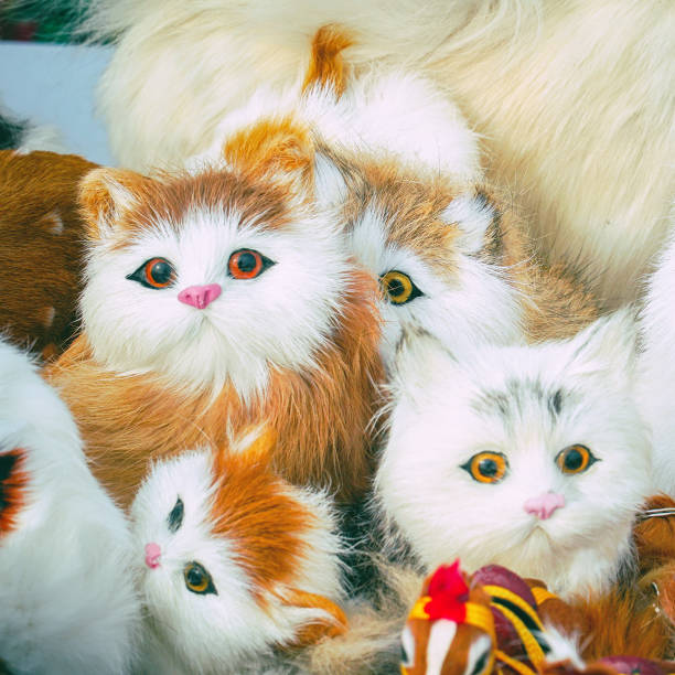 istock Soft toys kittens sitting in front of camera 1213807613