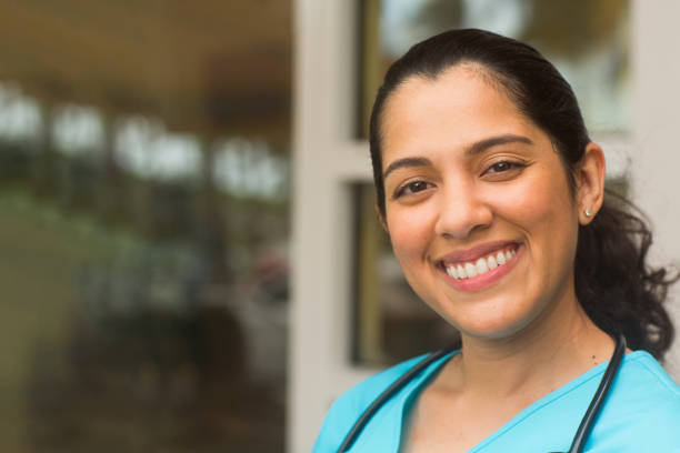 istock Confident hospital nurse smiling at work. 1213808473