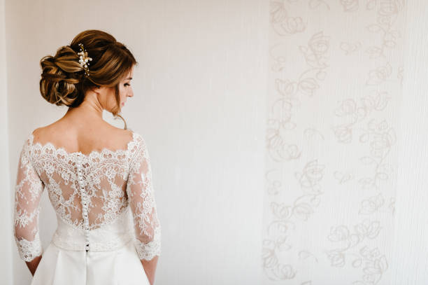 Portrait Of A Beautiful Stylish Bride With An Elegant Hairstyle View From  The Back Wedding People Fashion And Beauty Concept Bride In Wedding Dress  Back View Stock Photo - Download Image Now -