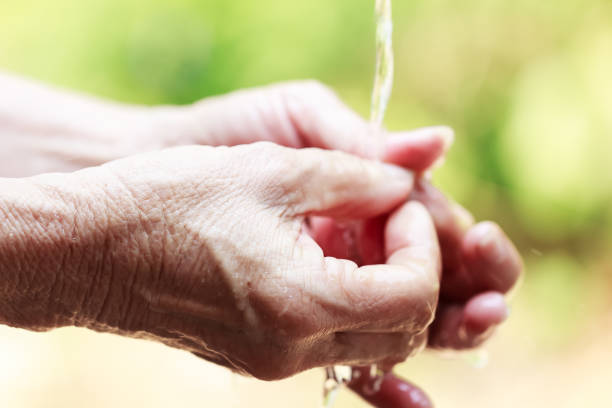 istock woman washing hands 1213812712