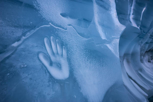 istock Human Hand Imprint on the Ice Wall in the Natural Cave 1213814600