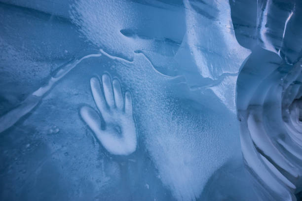 istock Human Hand Imprint on the Ice Wall in the Natural Cave 1213814627