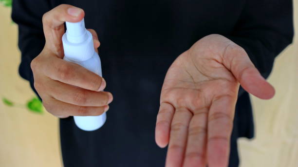 istock f Spray disinfectant liquid into the hands, to kill the virus 1213816021