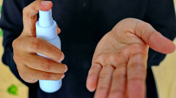 istock f Spray disinfectant liquid into the hands, to kill the virus 1213816038