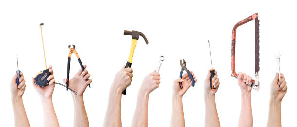 istock Hands holding different mechanic tool isolated on white background. object with clipping path. 1213816784