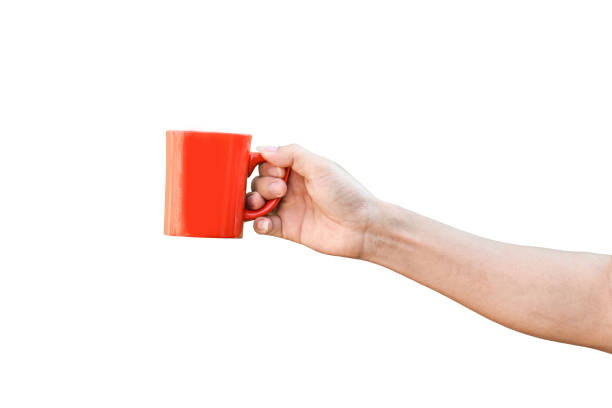 istock hand holding red cup isolated on white background with clipping path. 1213816785