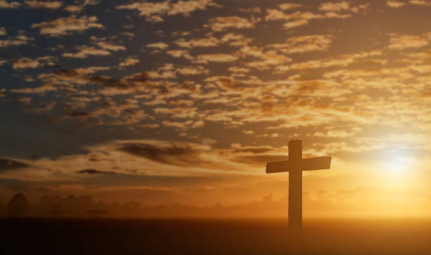 istock Silhouette of catholic cross at sunset background. 1213817666