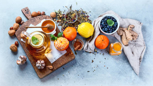 Remedies for cold and flu.Healthy food immune boosting selection. Remedies for cold and flu.Healthy food immune boosting selection.  Foods high in antioxidants, minerals and vitamins. Antiviral treatment immune system photos stock pictures, royalty-free photos & images