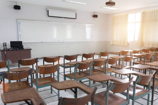 istock Schools in Asian shutdown due to Coronona Virus or COVID-19 spreading. An empty classroom with no student. 1213819163