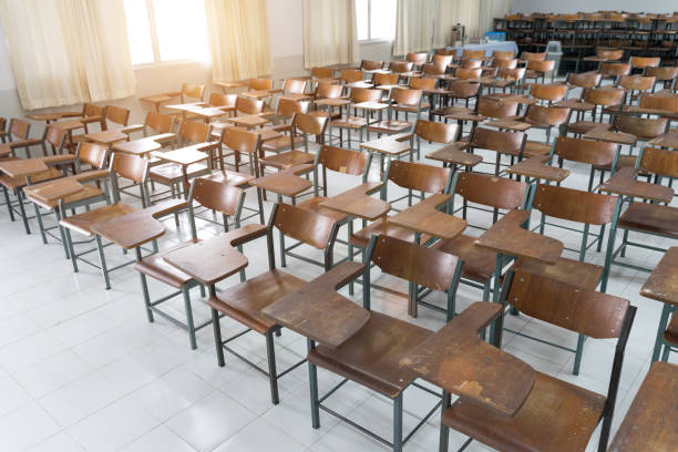 istock Schools in Asian shutdown due to Coronona Virus or COVID-19 spreading. An empty classroom with no student. 1213819216