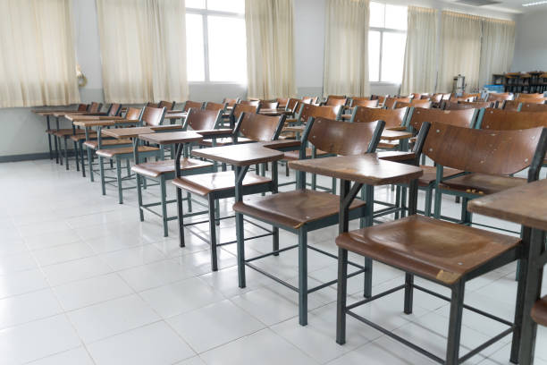 istock Schools in Asian shutdown due to Coronona Virus or COVID-19 spreading. An empty classroom with no student. 1213819776
