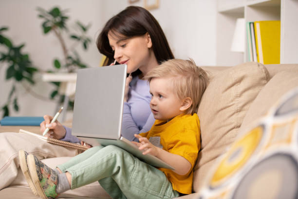 istock Little boy watching cartoon on laptop 1213821247