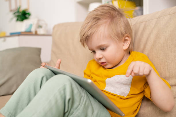 istock Talking to parent via telecommunication app on tablet 1213821842