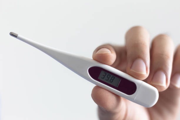 istock Close-up hands holding thermometer , covid-19 and coronavirus 1213823500