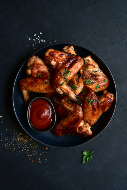 istock Grilled spicy chicken wings with ketchup 1213825249