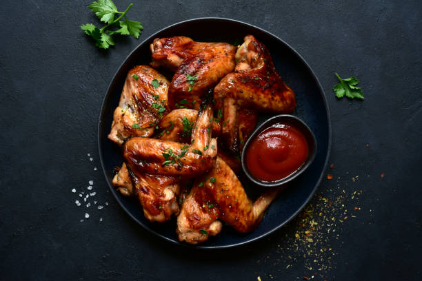istock Grilled spicy chicken wings with ketchup 1213825393