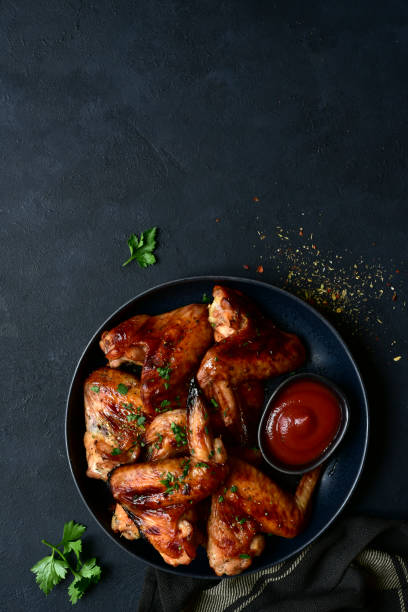 istock Grilled spicy chicken wings with ketchup 1213825628