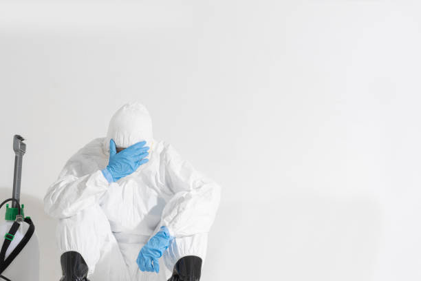 istock virologist, wearing PPE. She is feeling hopeless and tired. 1213826334