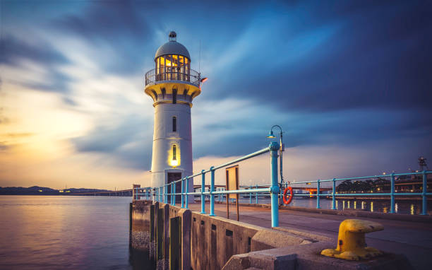 istock Raffles Marina lighthouse SIngapore near TUAS checkpoint evening sun with clouds 1213826645