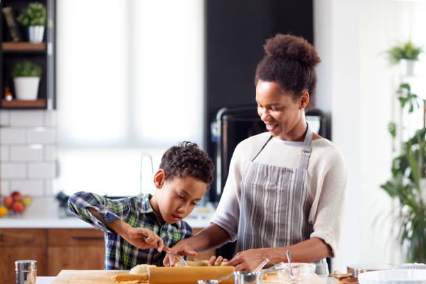 istock Mother with his son prepare pie in the kitchen 1213829126