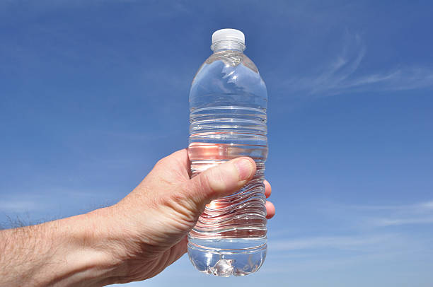 istock Hand Holding a Bottle of Water 121383068